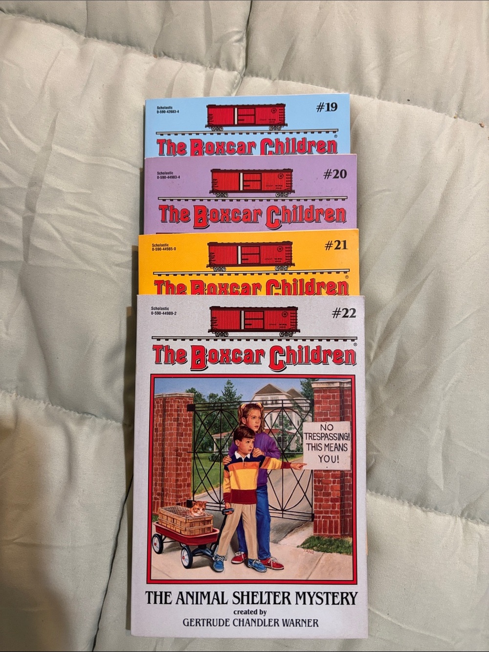 Scholastic The Boxcar Children set - blue, pink, yellow, white covers